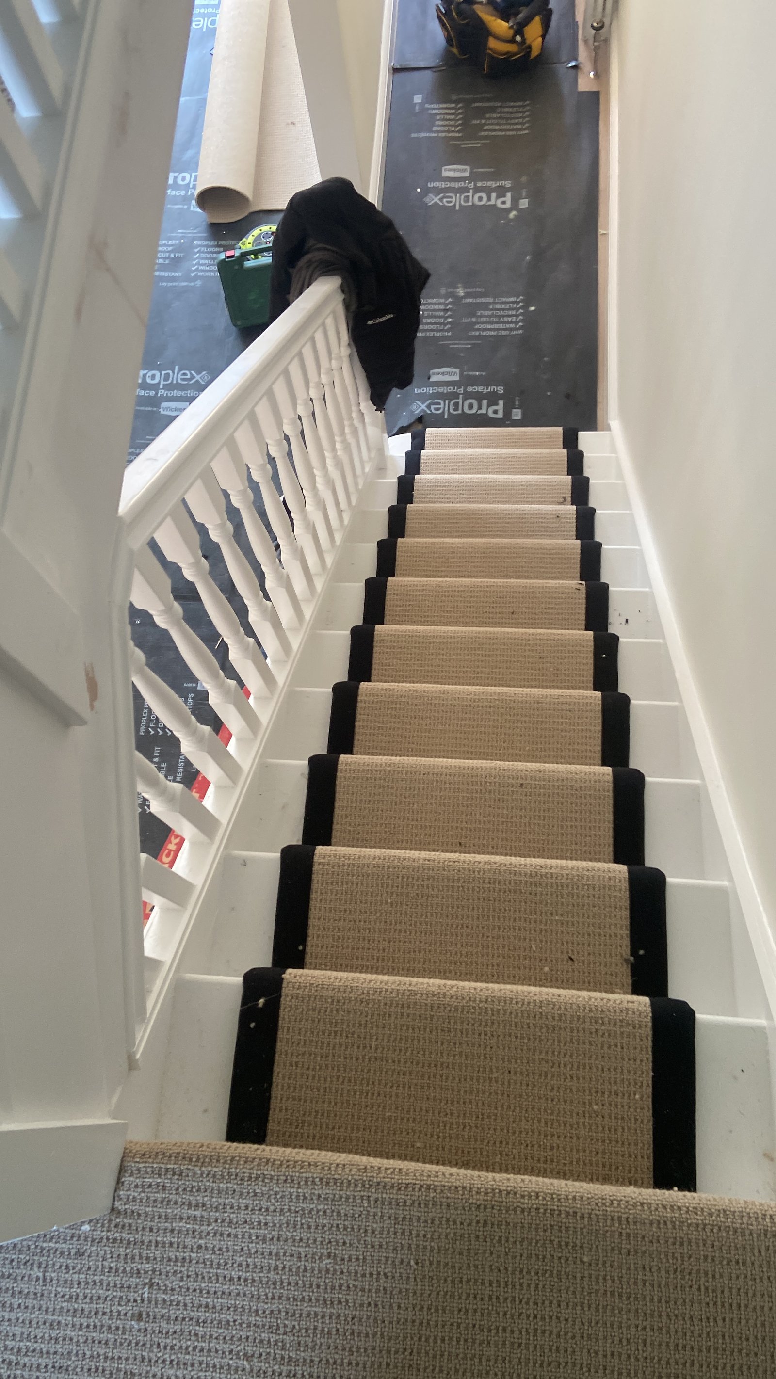 Professional Stair Runner Installation in Progress